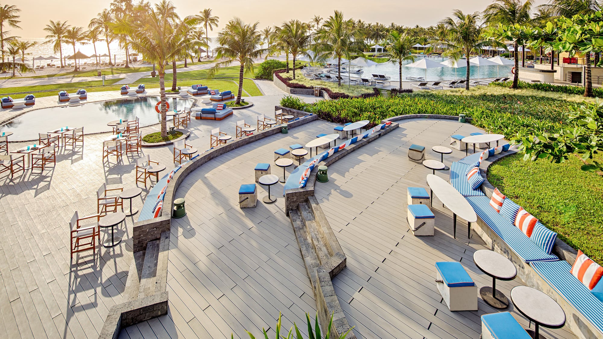 a pool with tables and chairs