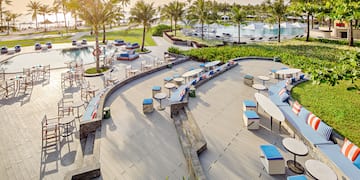 a pool with tables and chairs