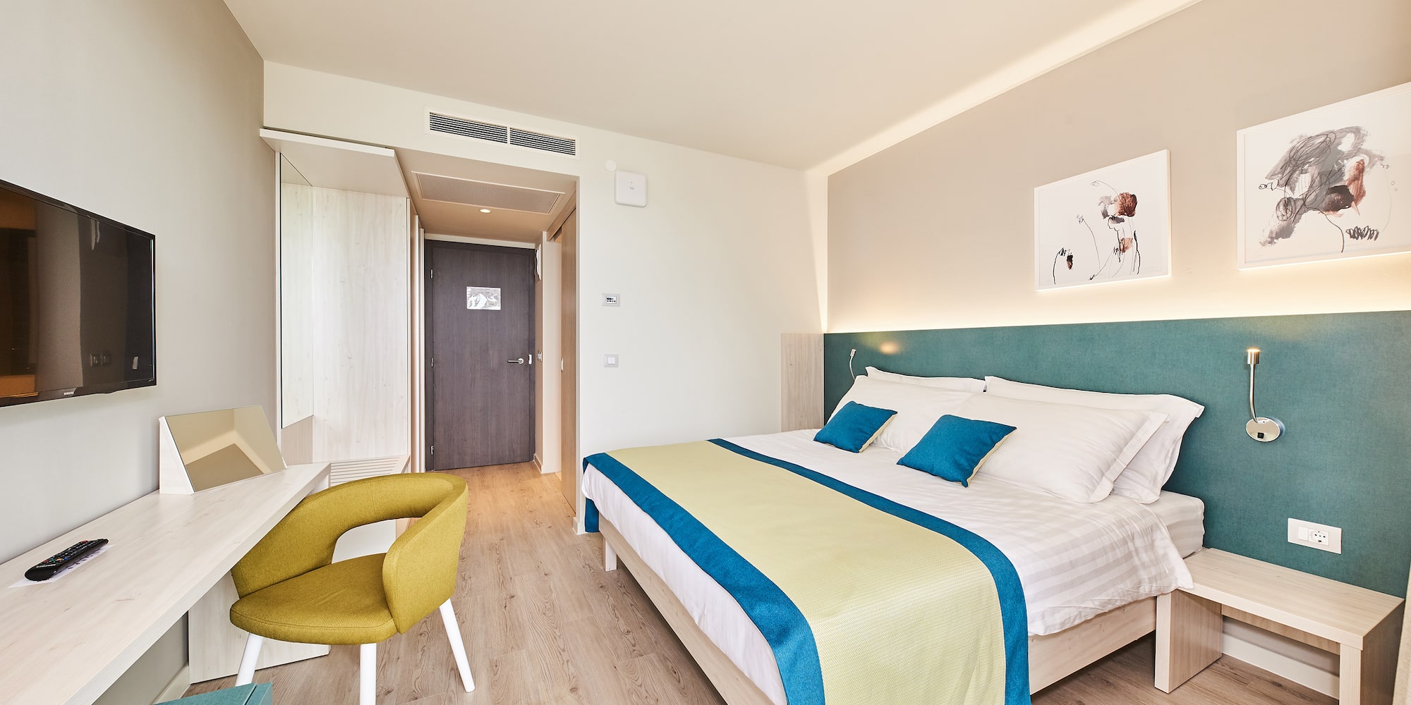 a bedroom with a bed and a desk