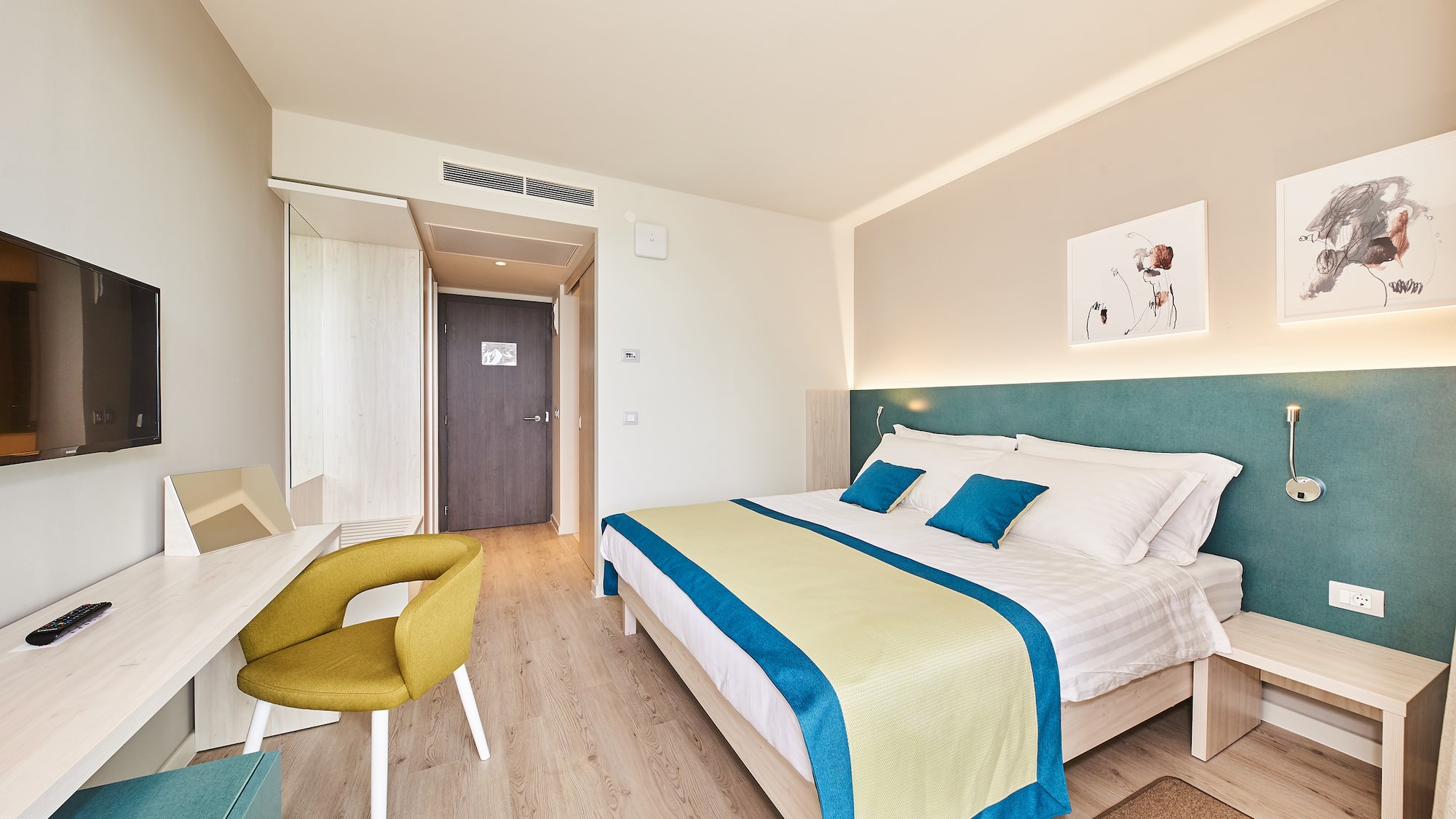 a bedroom with a bed and a desk