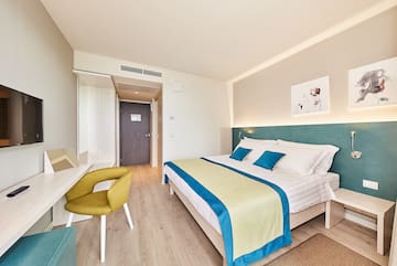 a bedroom with a bed and a desk