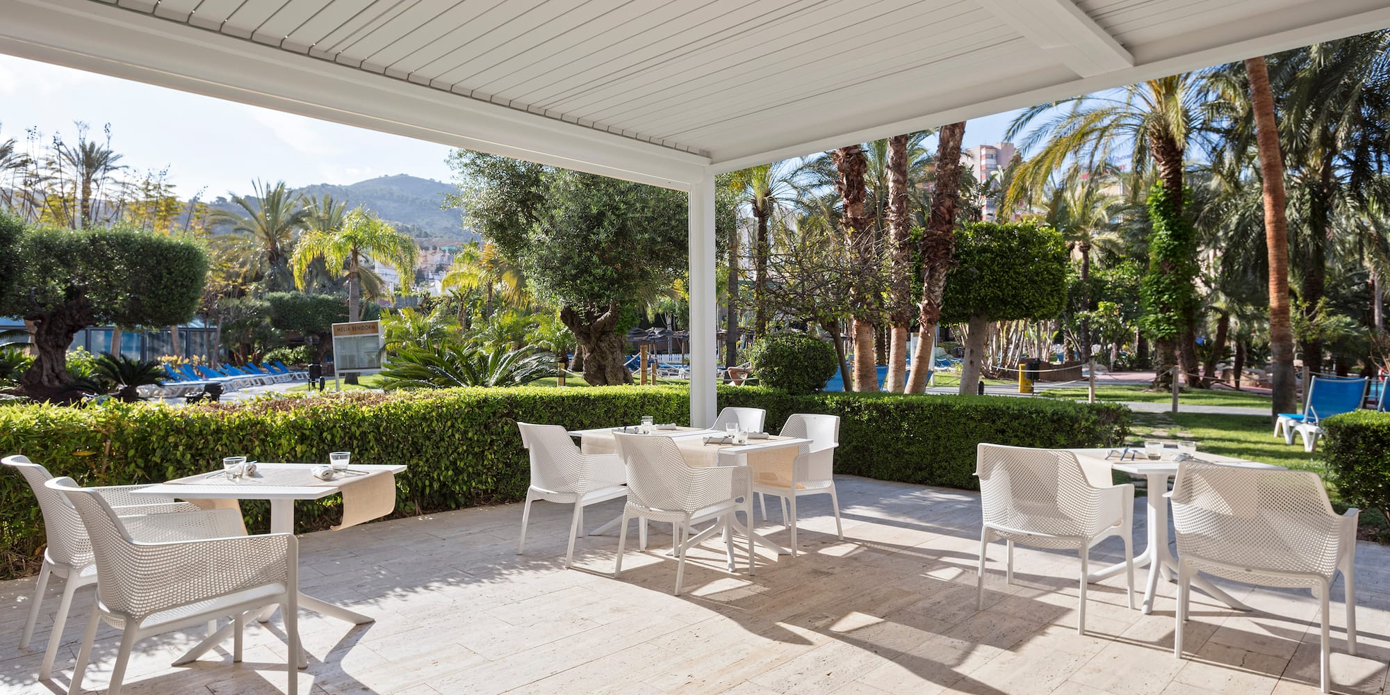 a white table and chairs on a patio