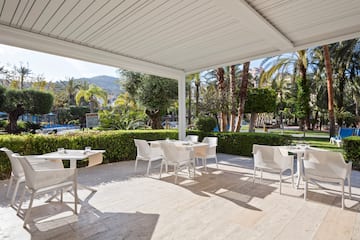 a white table and chairs on a patio
