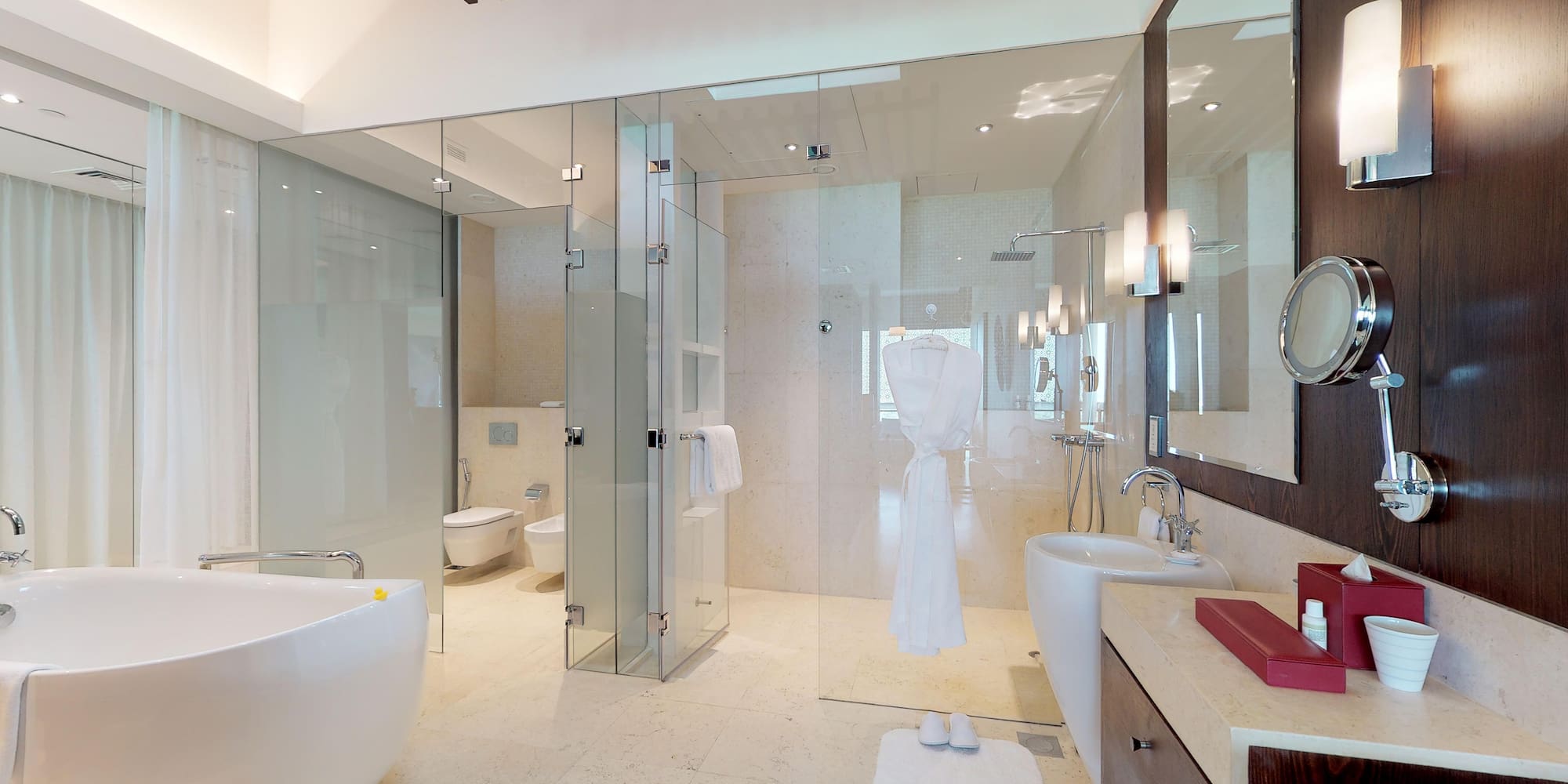 a bathroom with glass doors and a bathtub