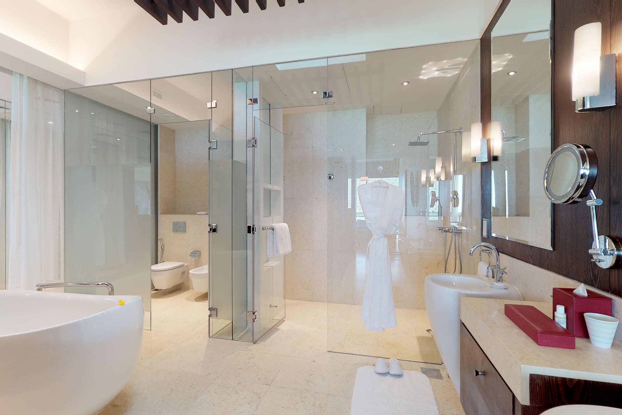 a bathroom with glass doors and a bathtub