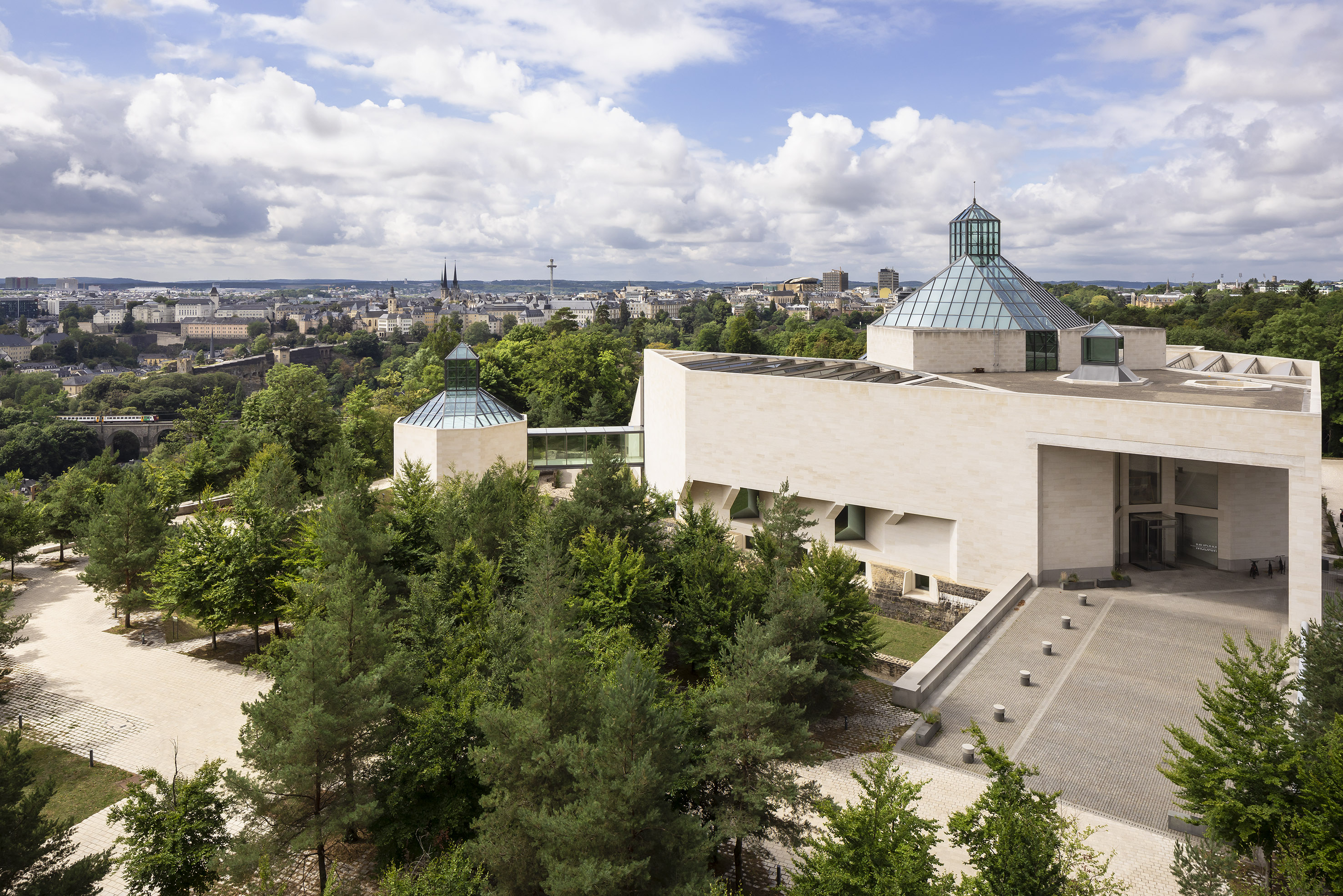 Modern Mudam Museum, Luxembourg, with striking glass domes and city panorama.
