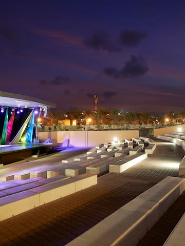 a outdoor stage with lights and seating
