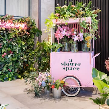 a pink cart with flowers on it