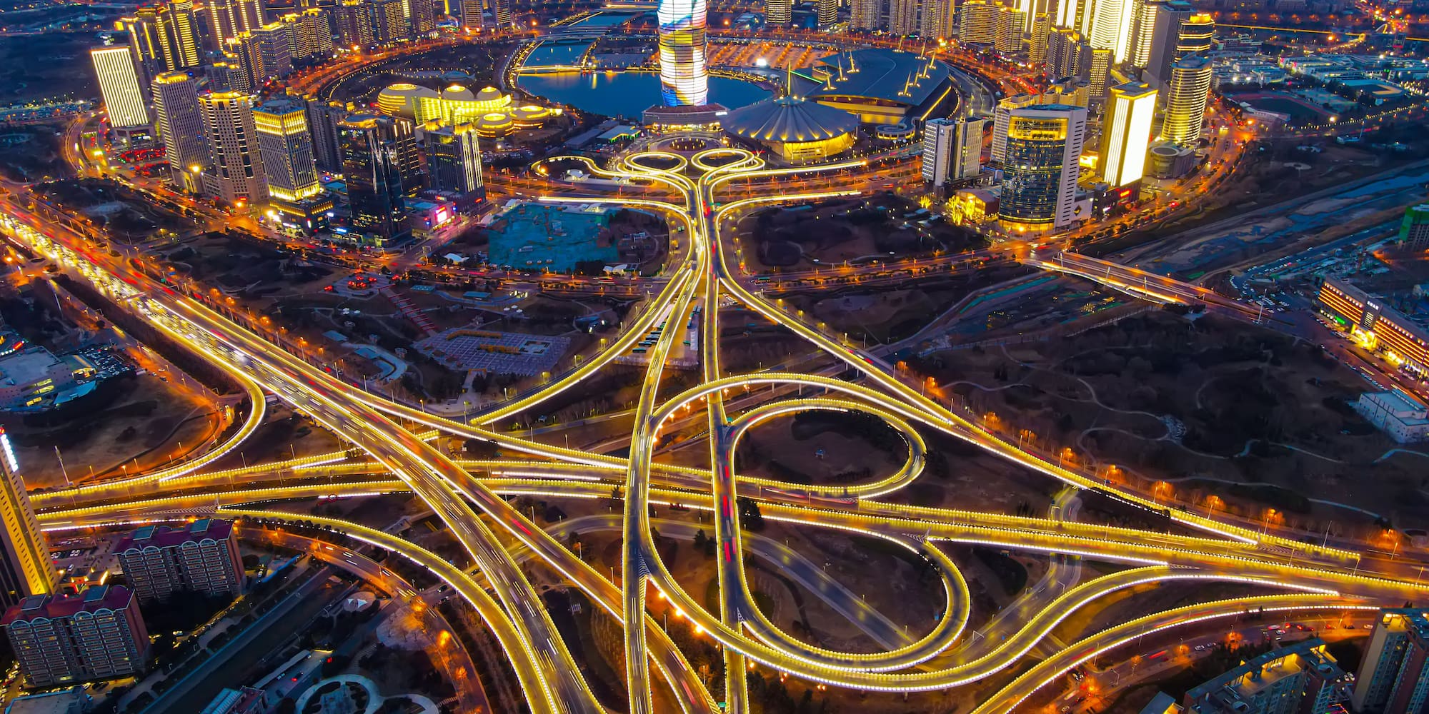 a city with lights on roads