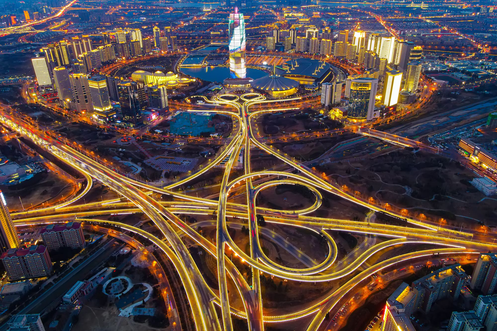 a city with lights on roads