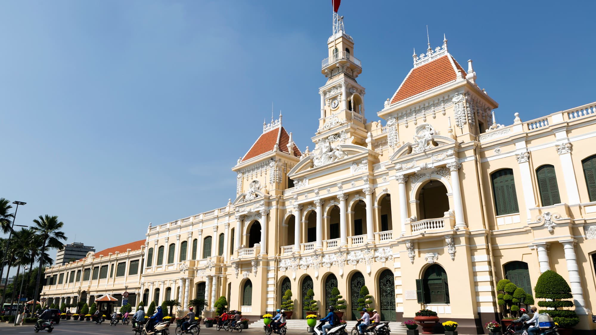 a building with many people riding motorcycles