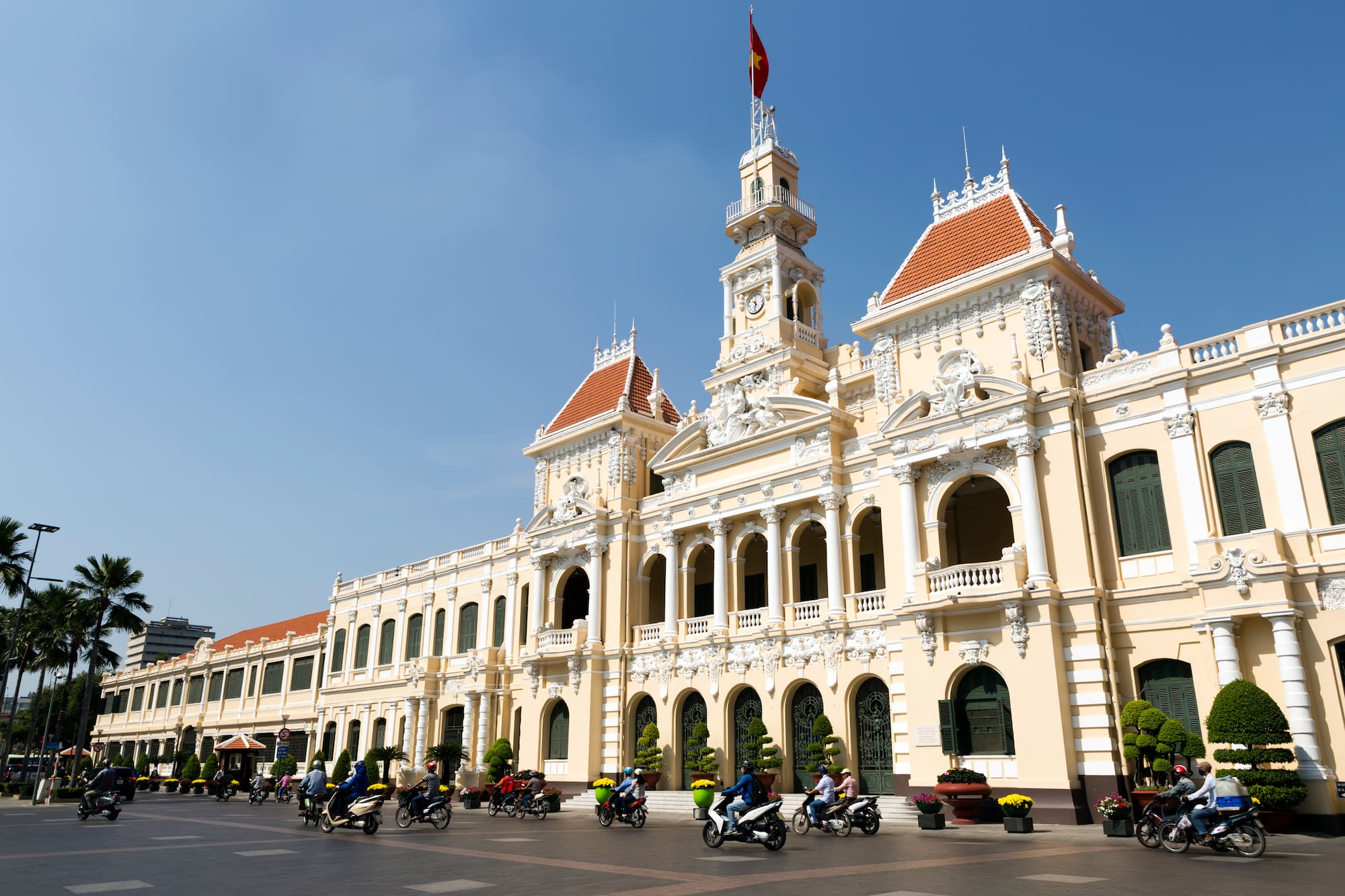 a building with many people riding motorcycles