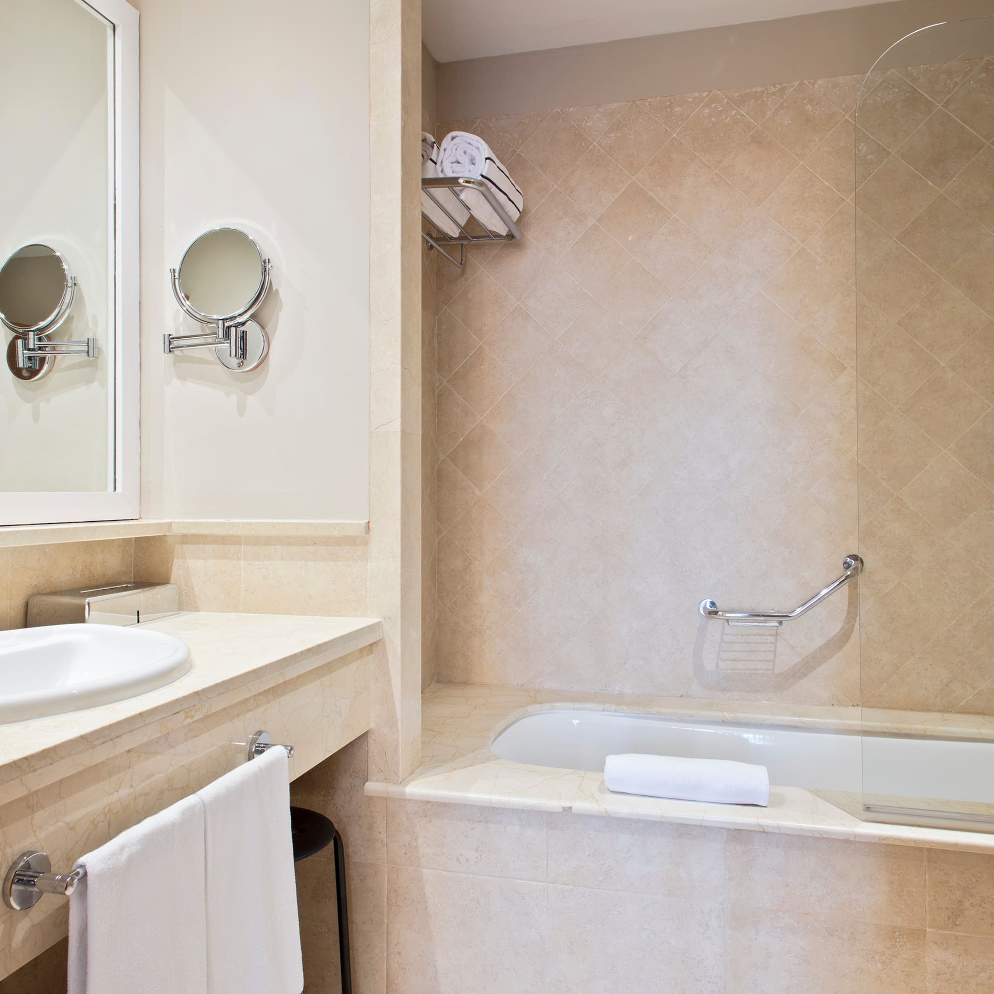 a bathroom with a bathtub and a mirror