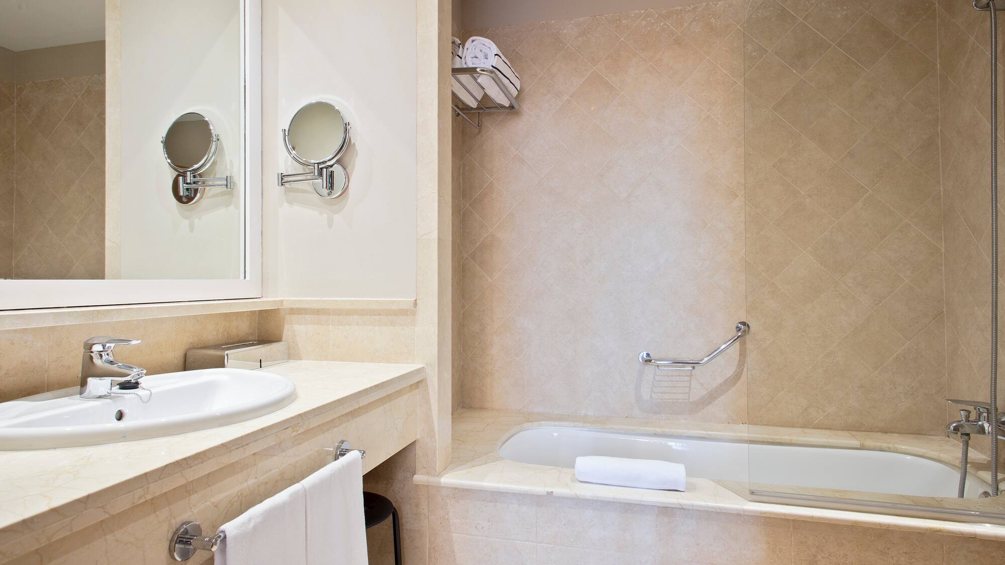 a bathroom with a bathtub and a mirror