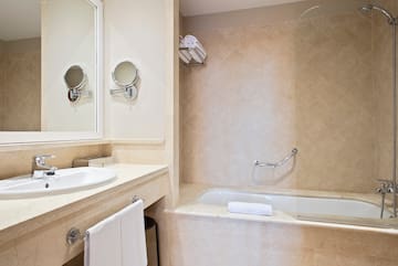 a bathroom with a bathtub and a mirror