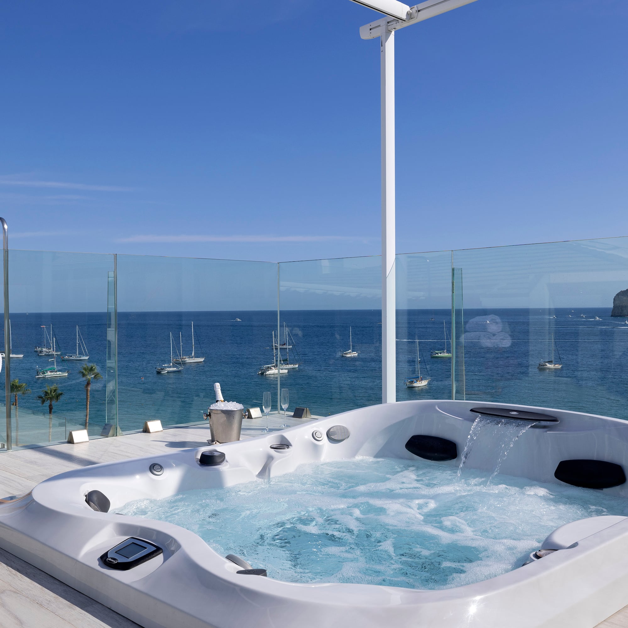 a hot tub with a view of the ocean