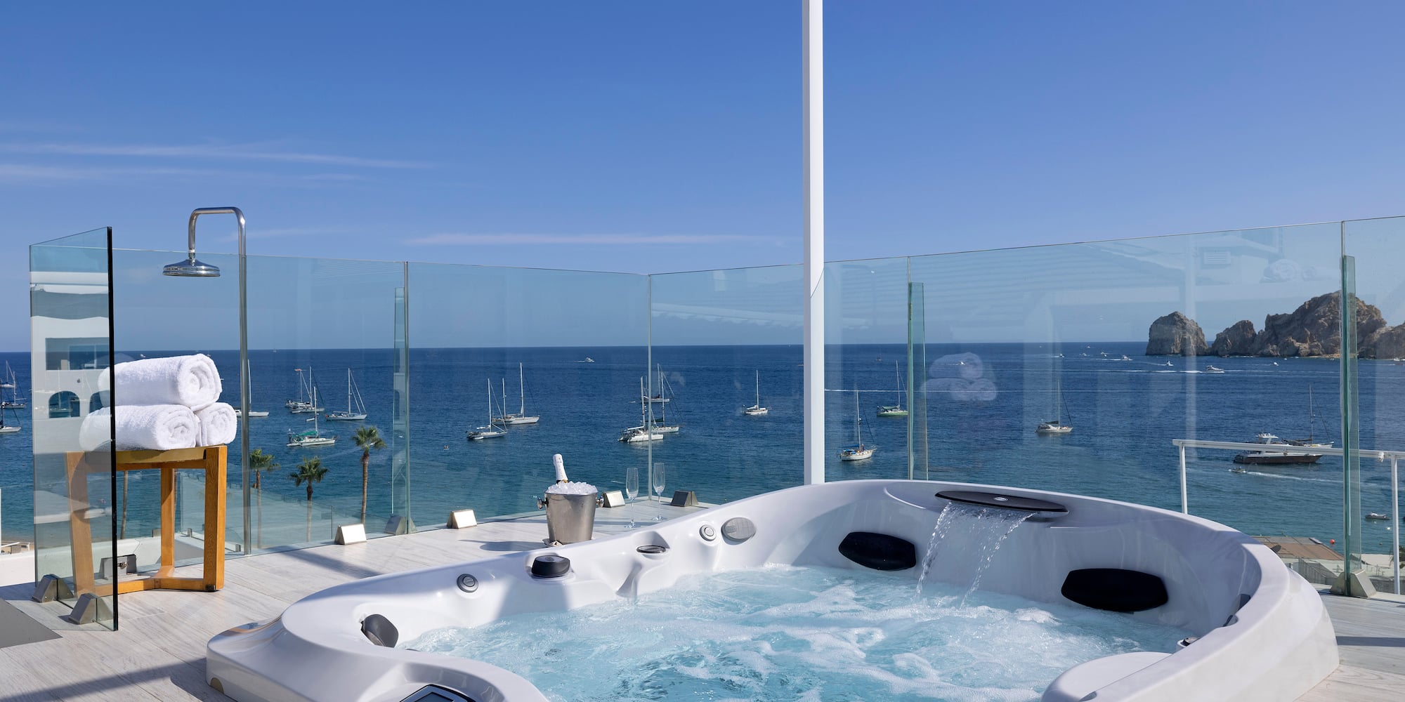 a hot tub with a view of the ocean