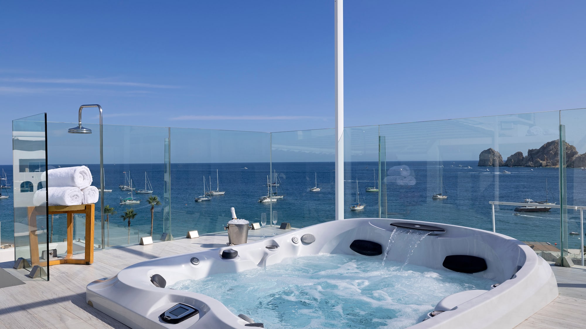 a hot tub with a view of the ocean