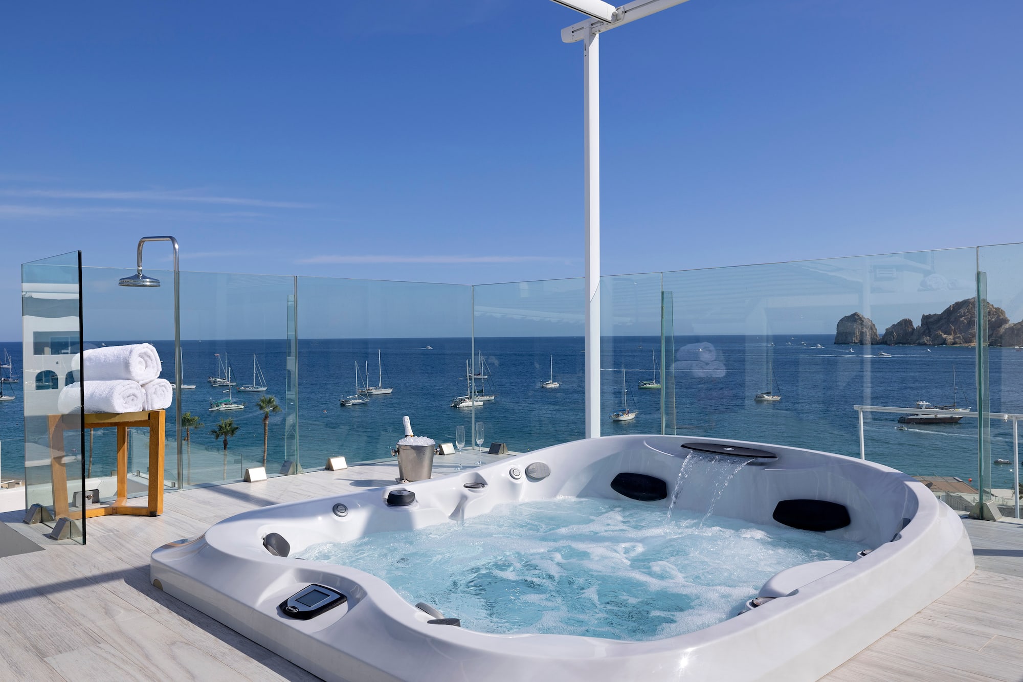 a hot tub with a view of the ocean