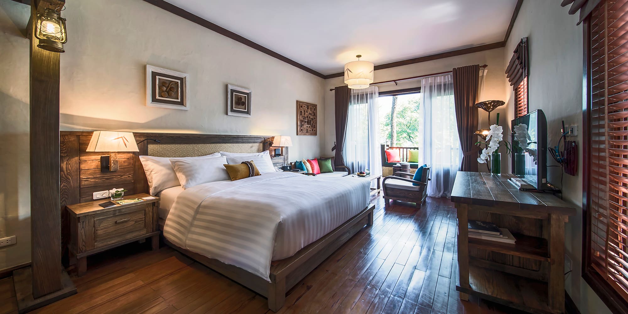 a bedroom with a bed and a wood floor