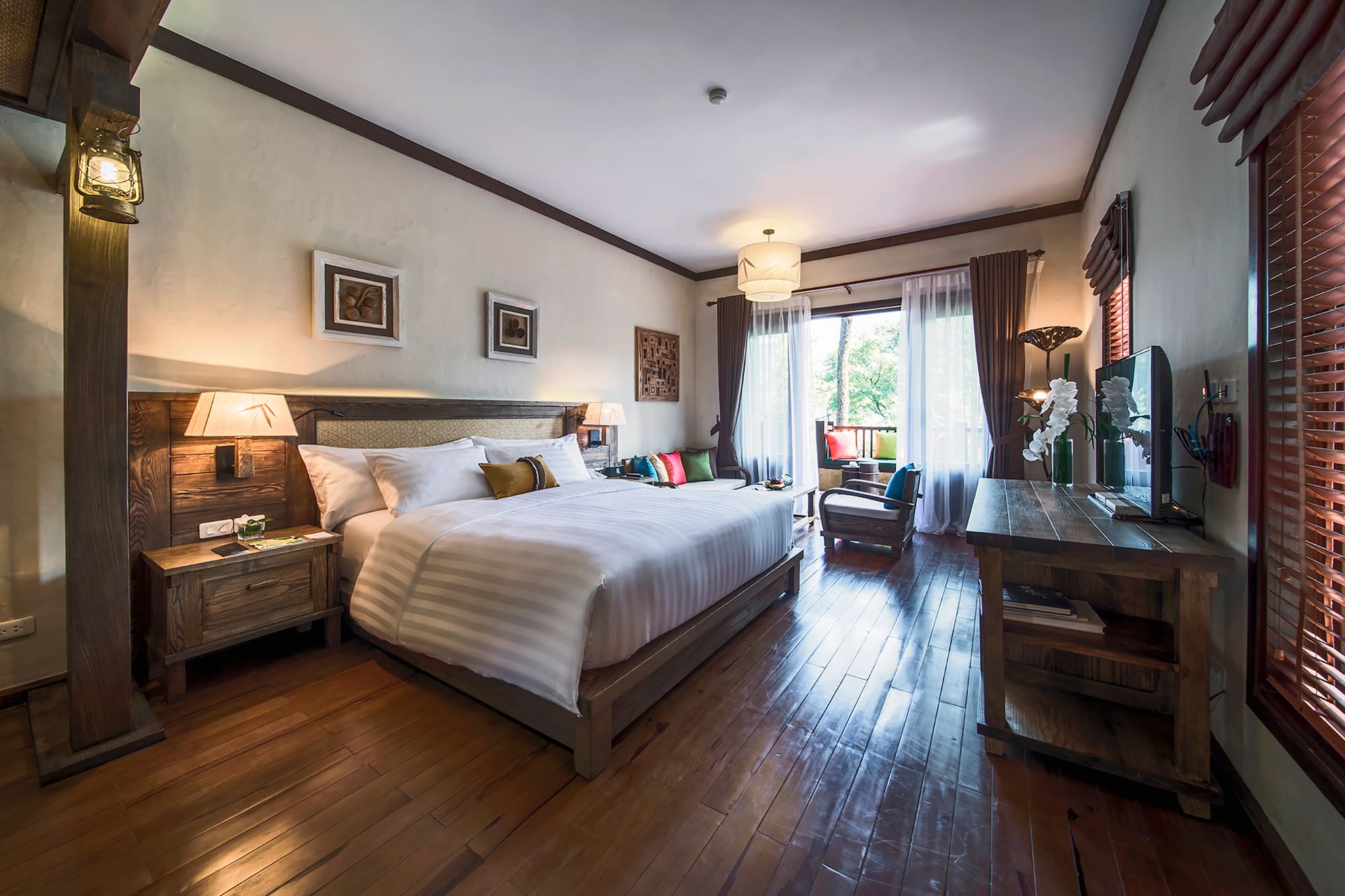 a bedroom with a bed and a wood floor