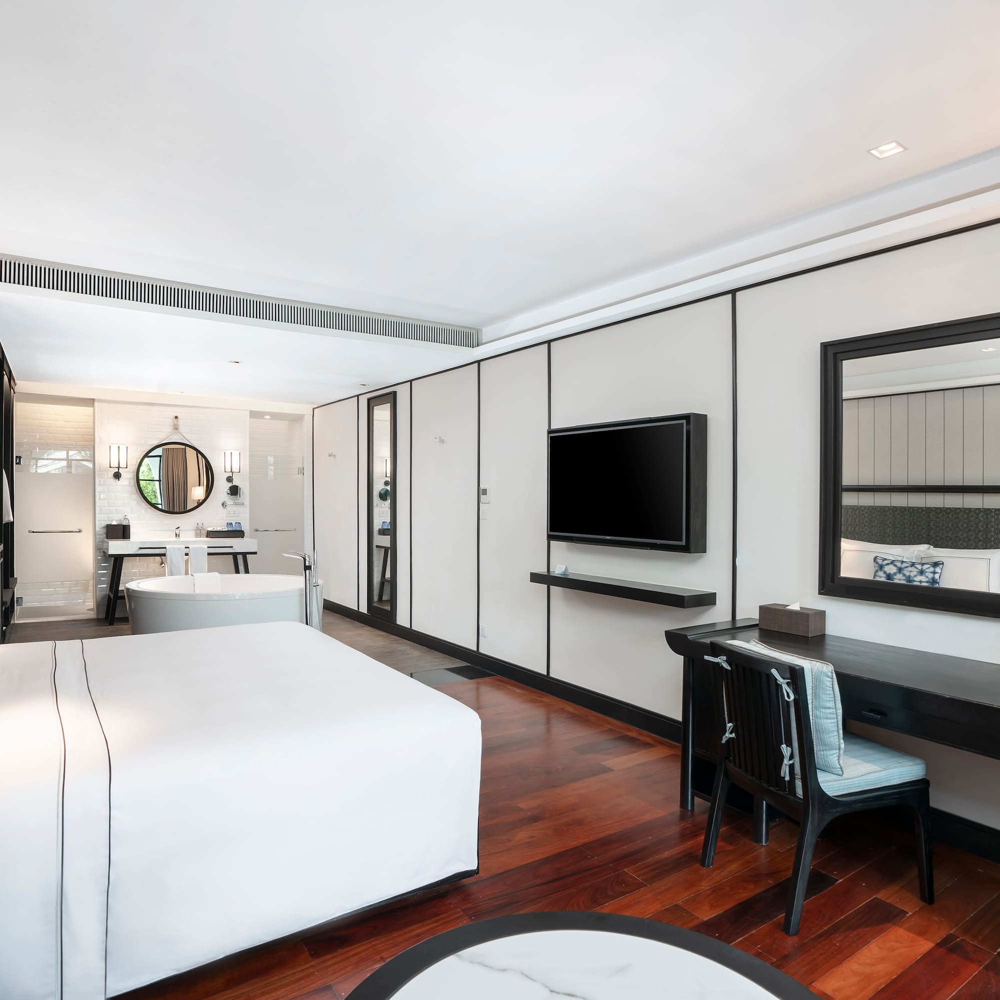 a room with a bed and a desk