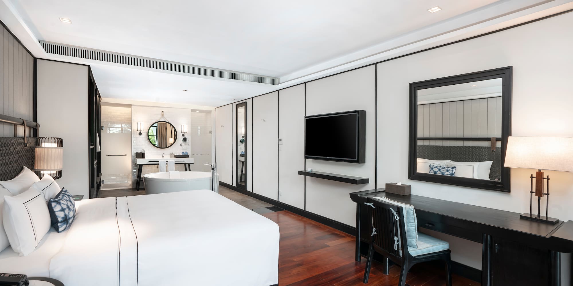 a room with a bed and a desk