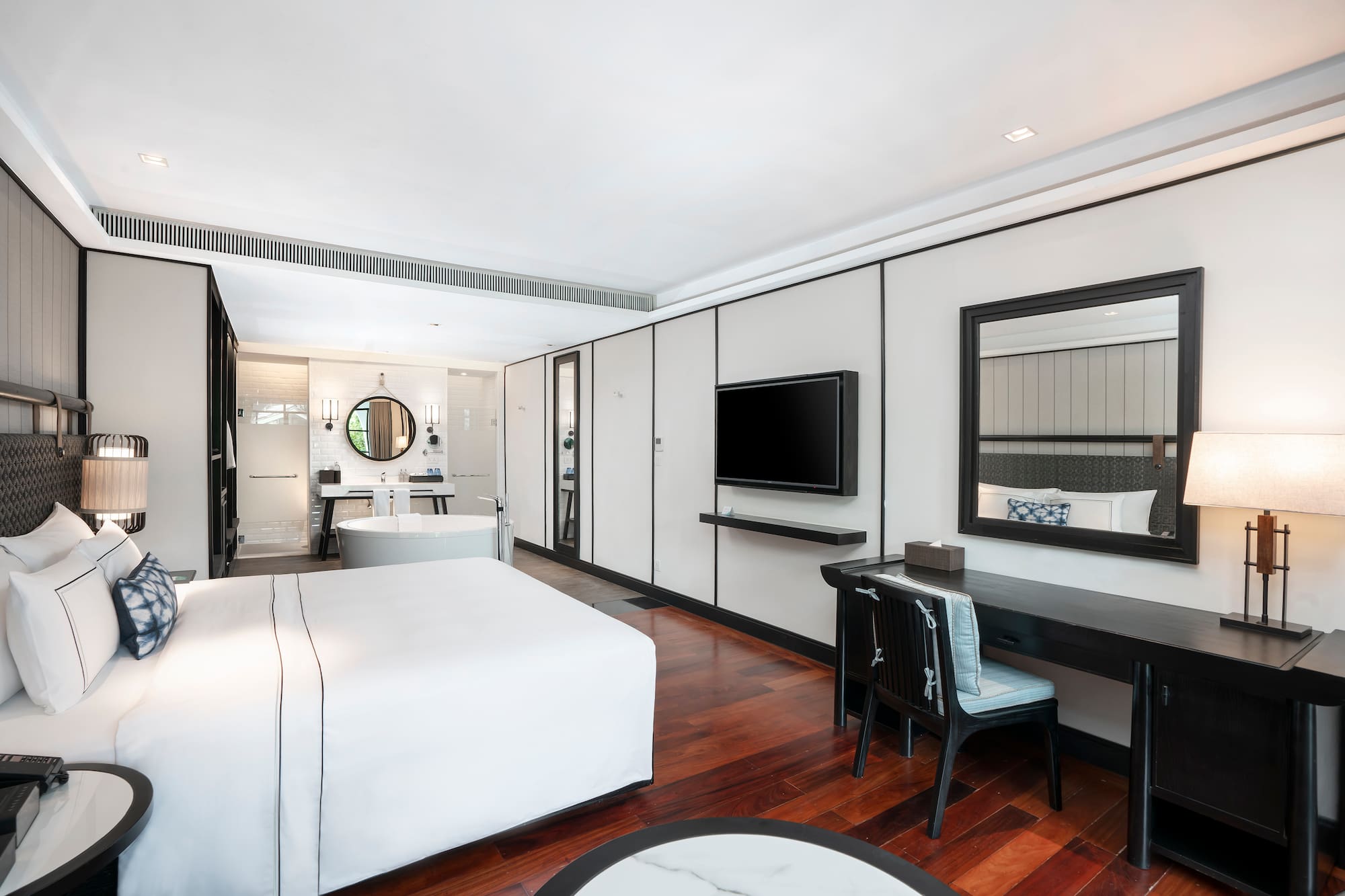 a room with a bed and a desk