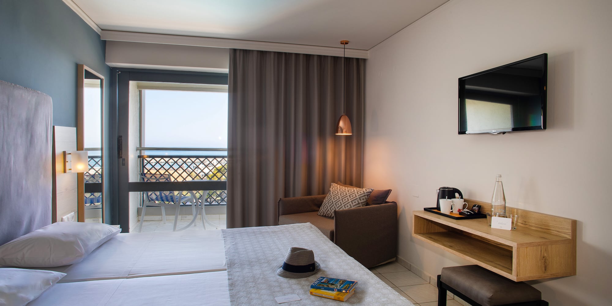 a room with a bed and a television