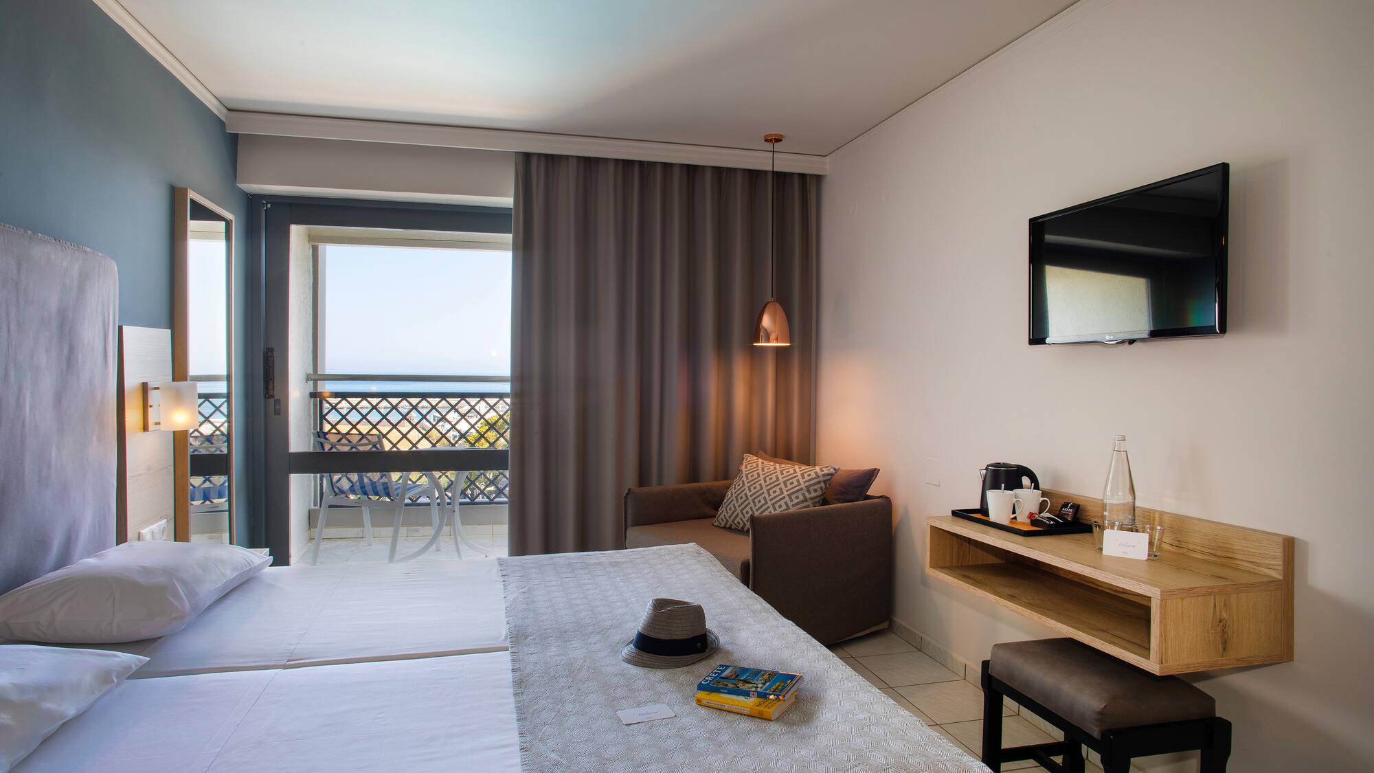 a room with a bed and a television