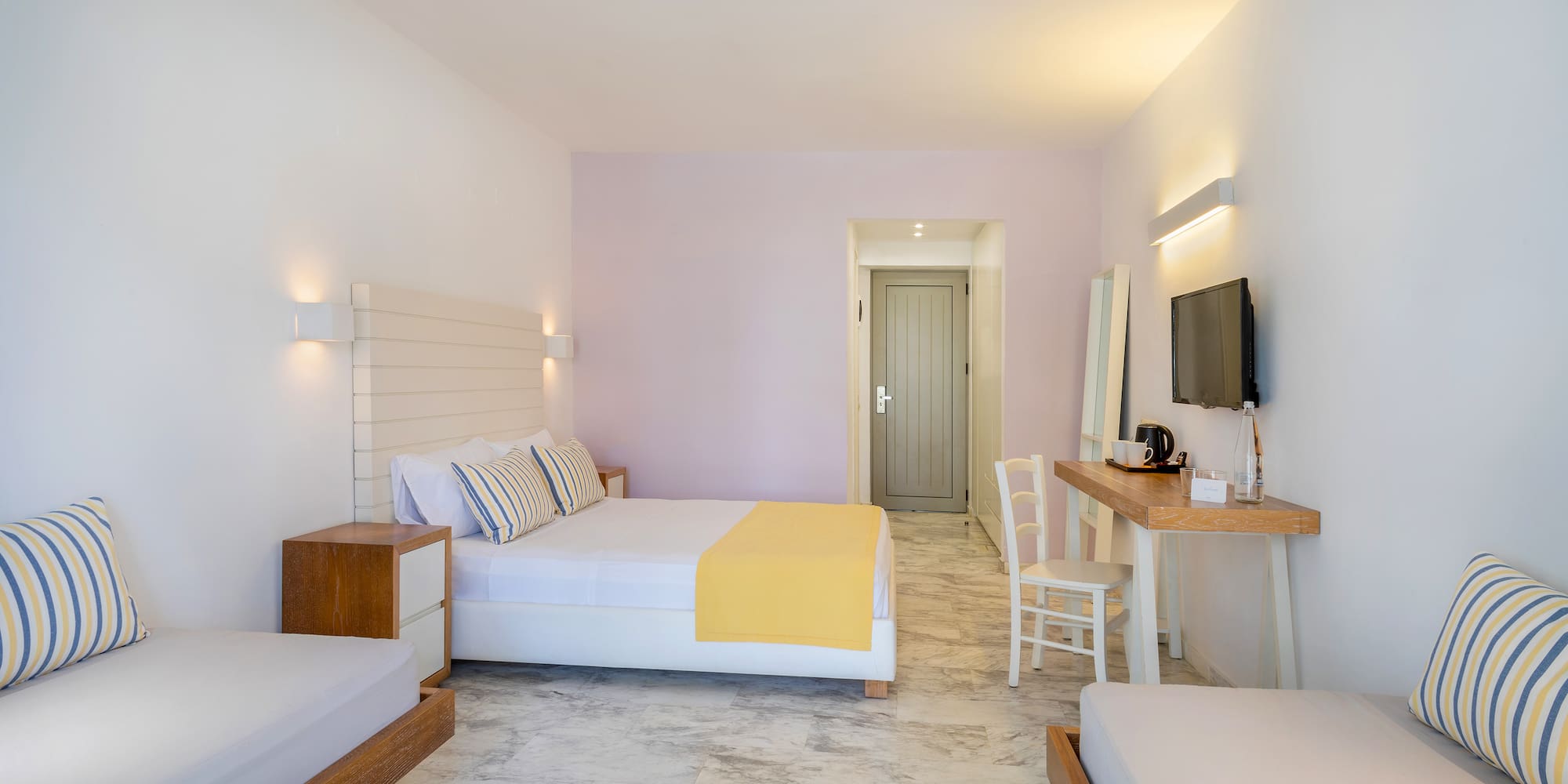 a room with a bed and a television