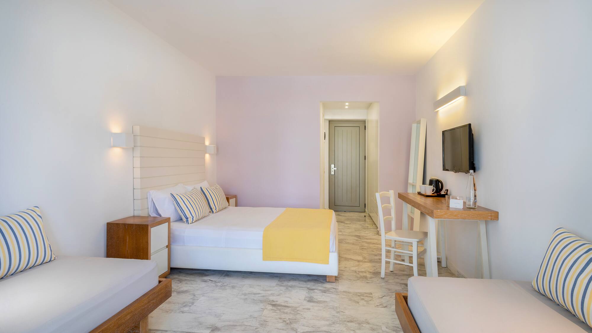 a room with a bed and a television