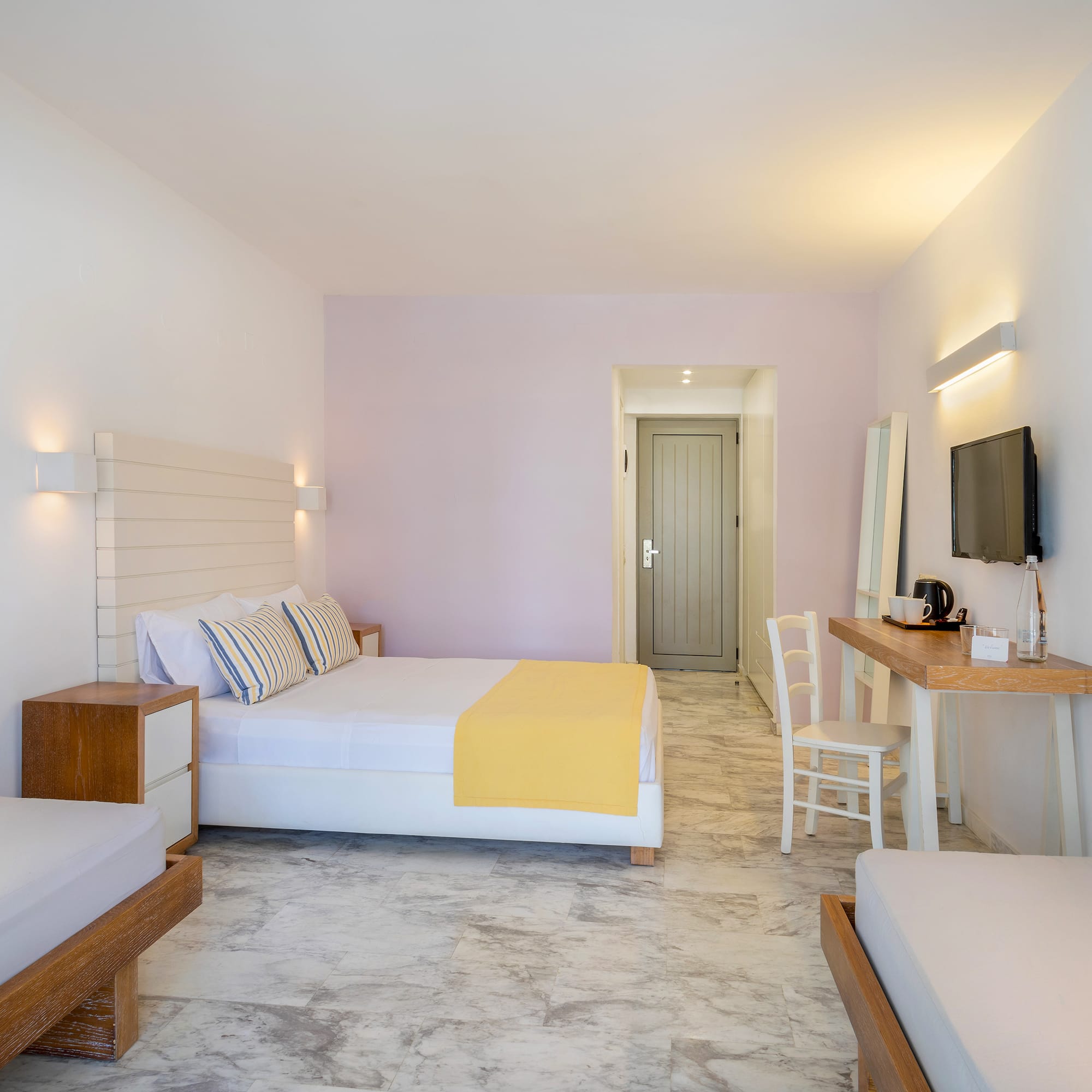 a room with a bed and a television