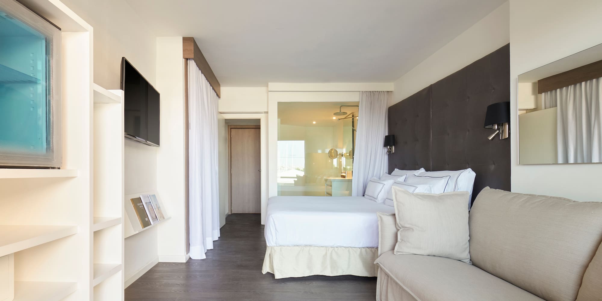 a bedroom with a bed and a couch