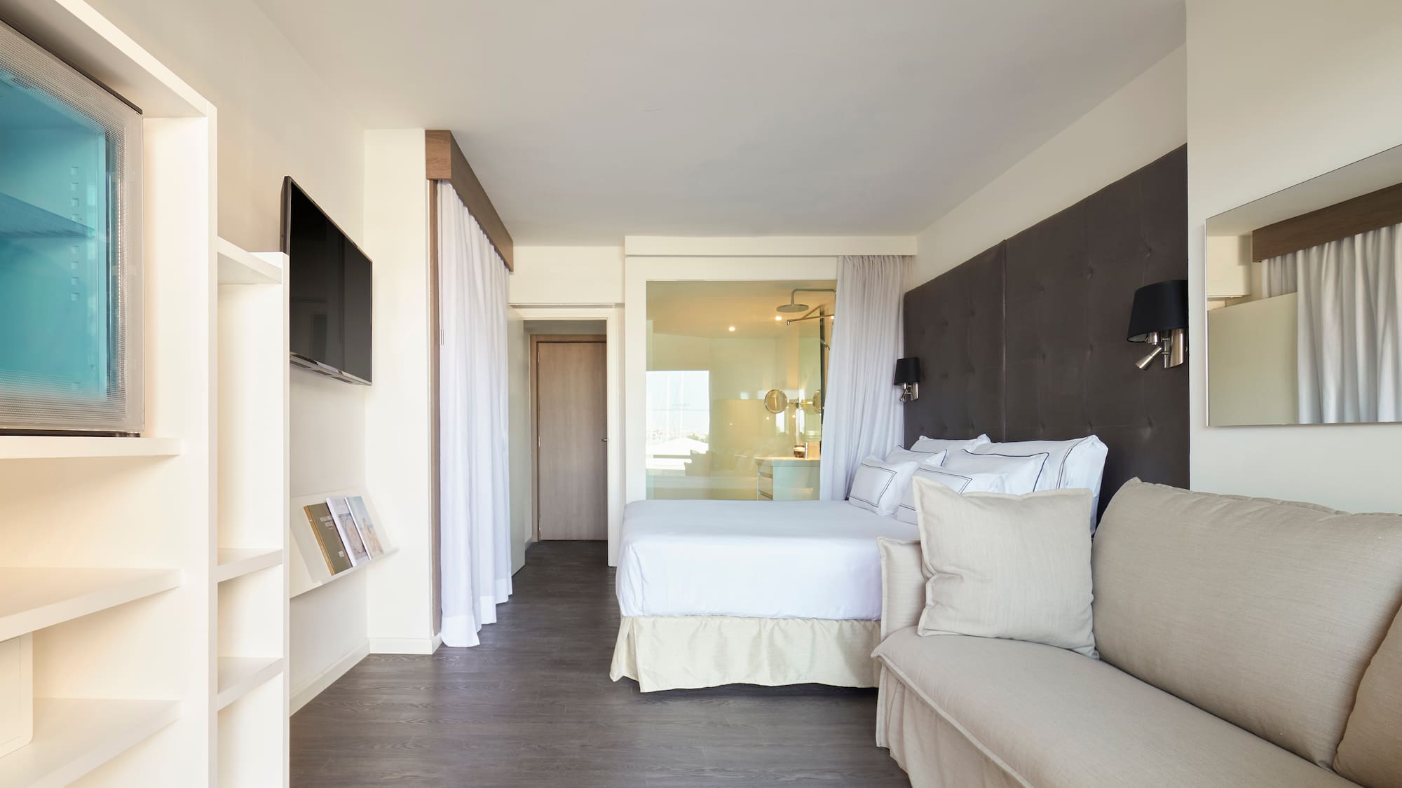 a bedroom with a bed and a couch