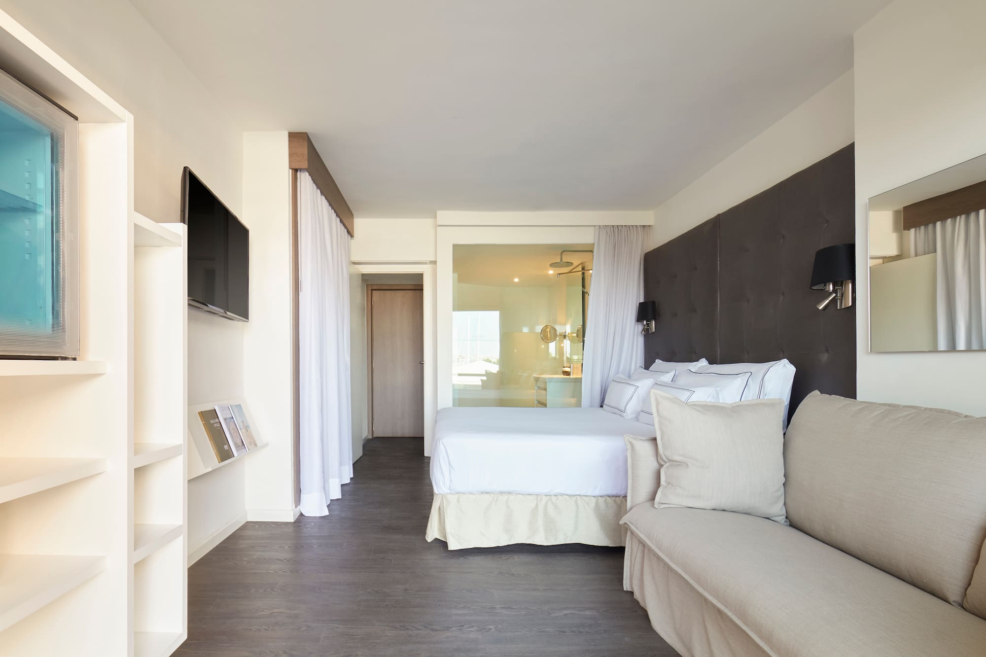 a bedroom with a bed and a couch