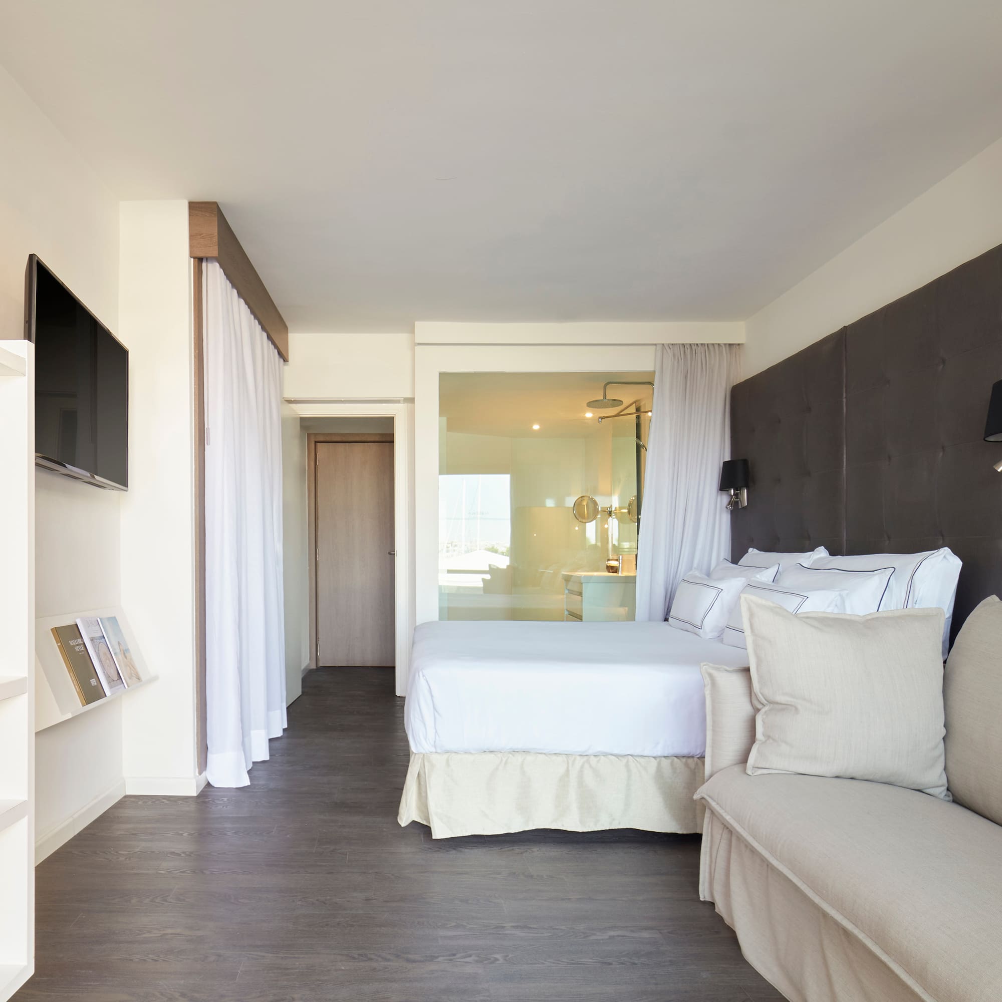 a bedroom with a bed and a couch