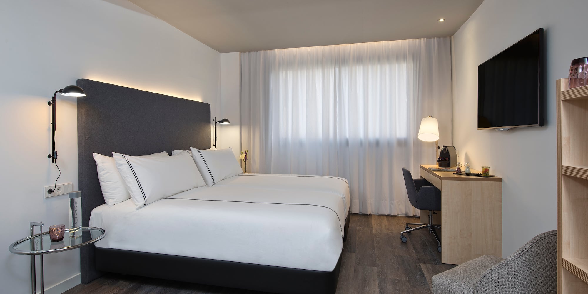 a room with a bed and a desk