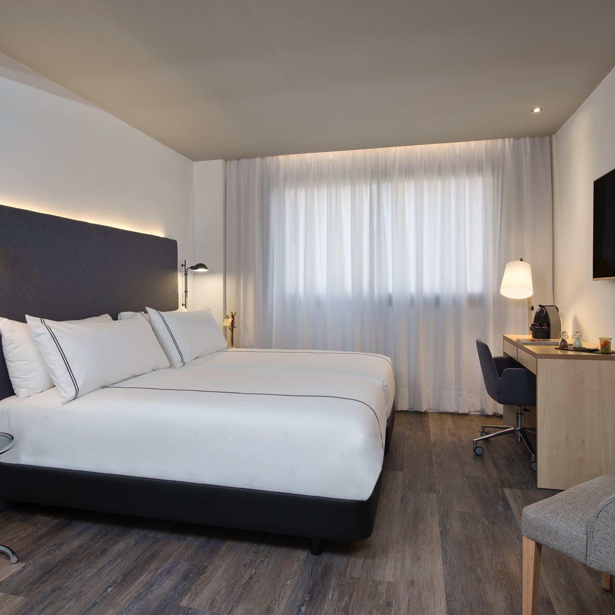 a room with a bed and a desk