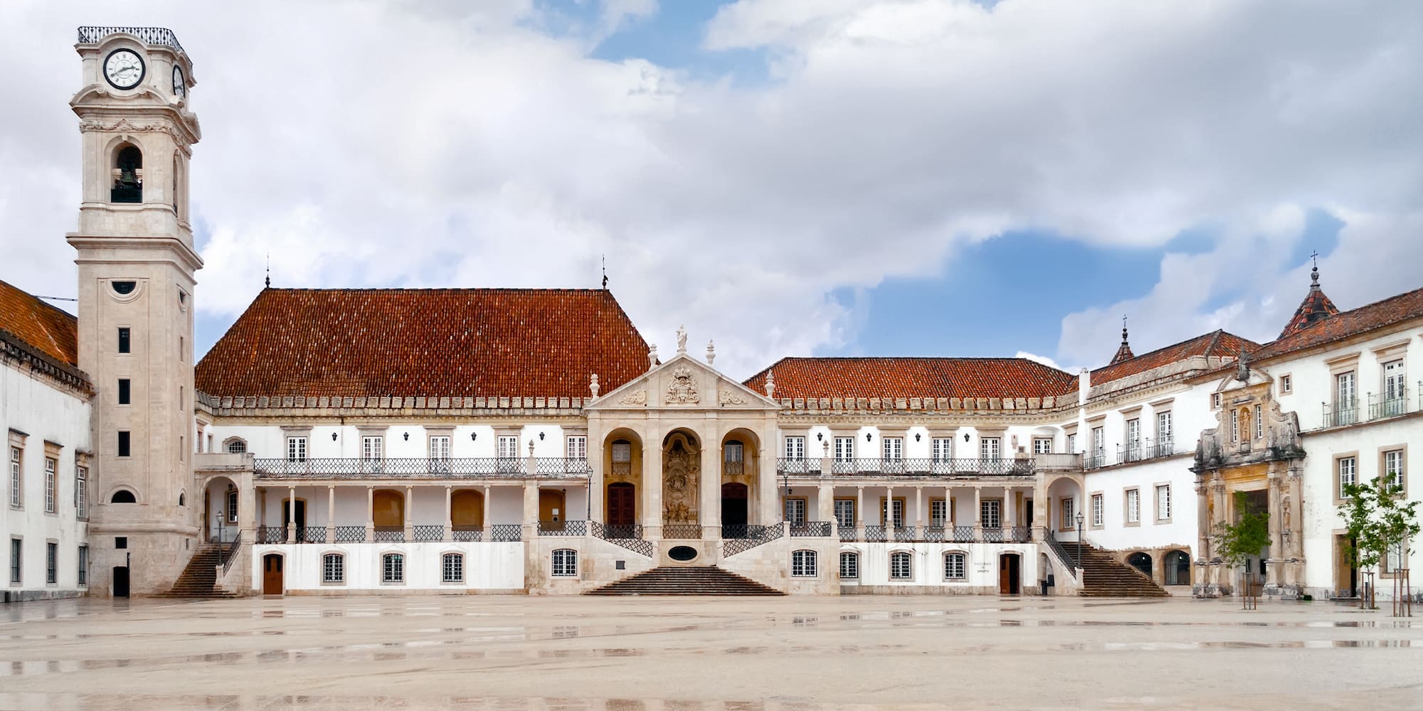 a large white building with red roofs