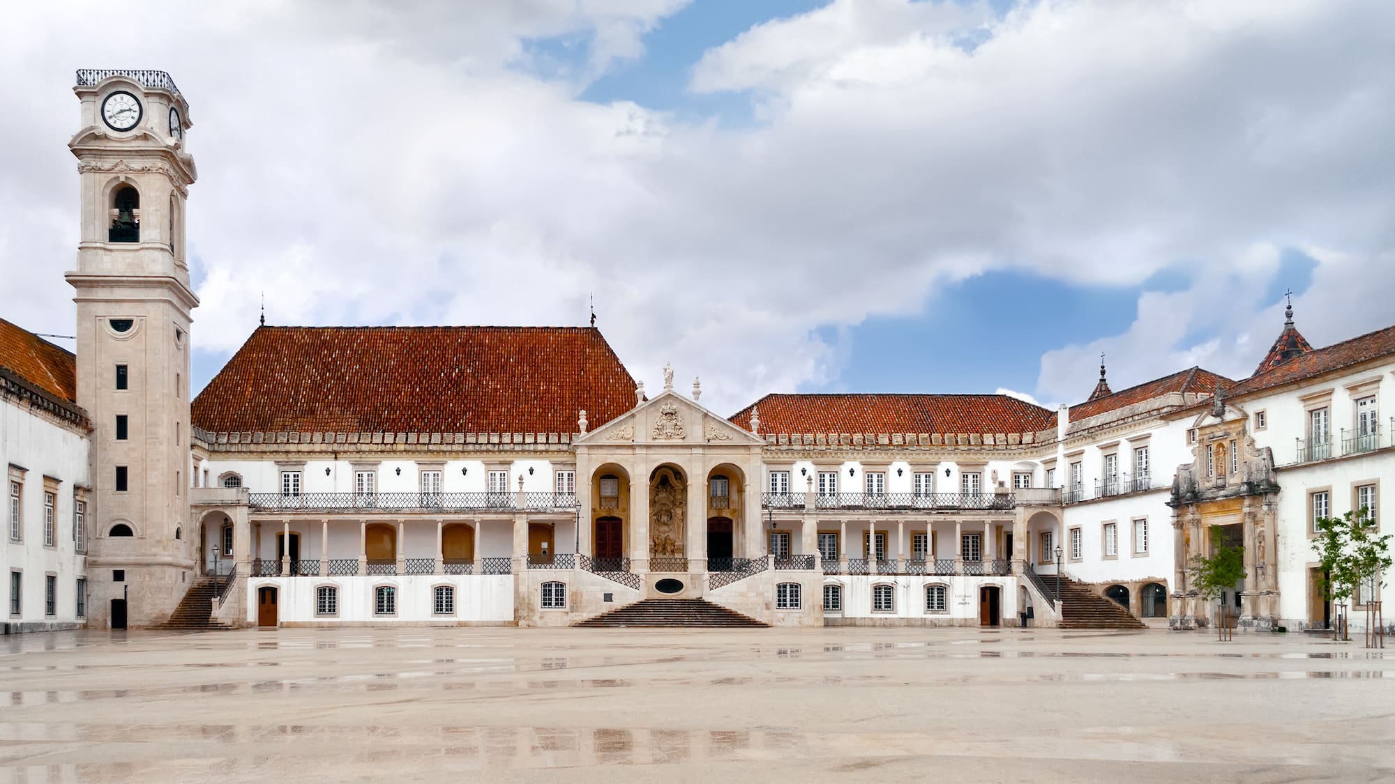 a large white building with red roofs