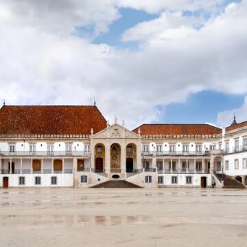 a large white building with red roofs