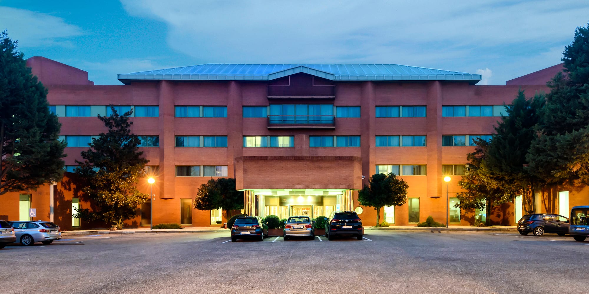 a building with cars parked in front of it