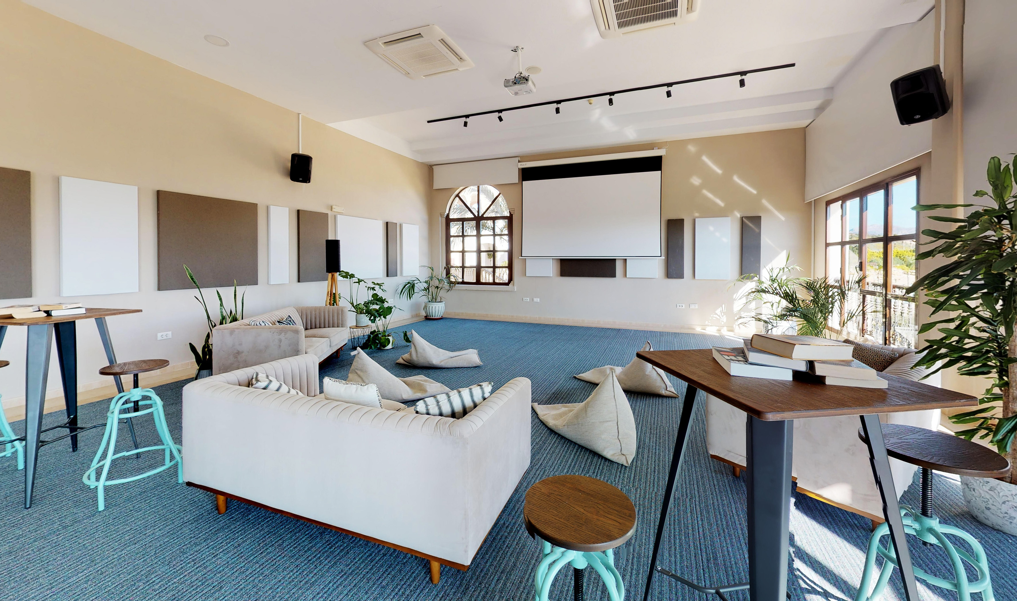 a room with couches and pillows