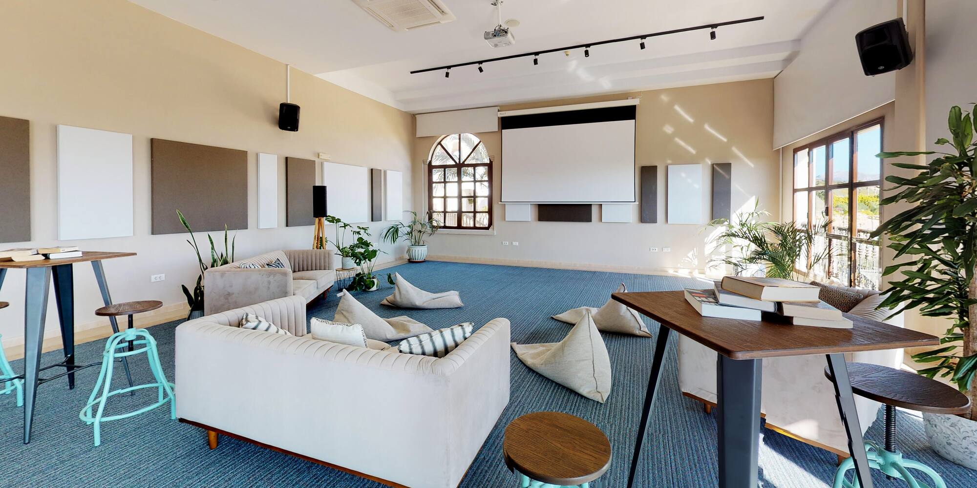 a room with couches and pillows