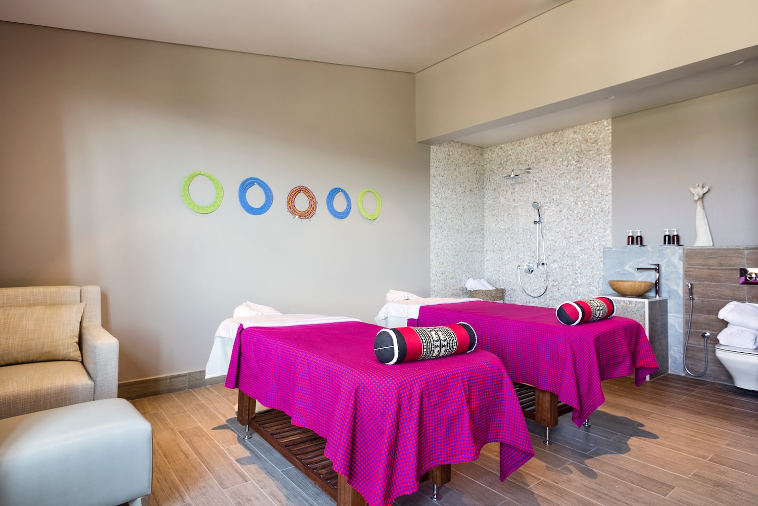 a room with beds and a shower