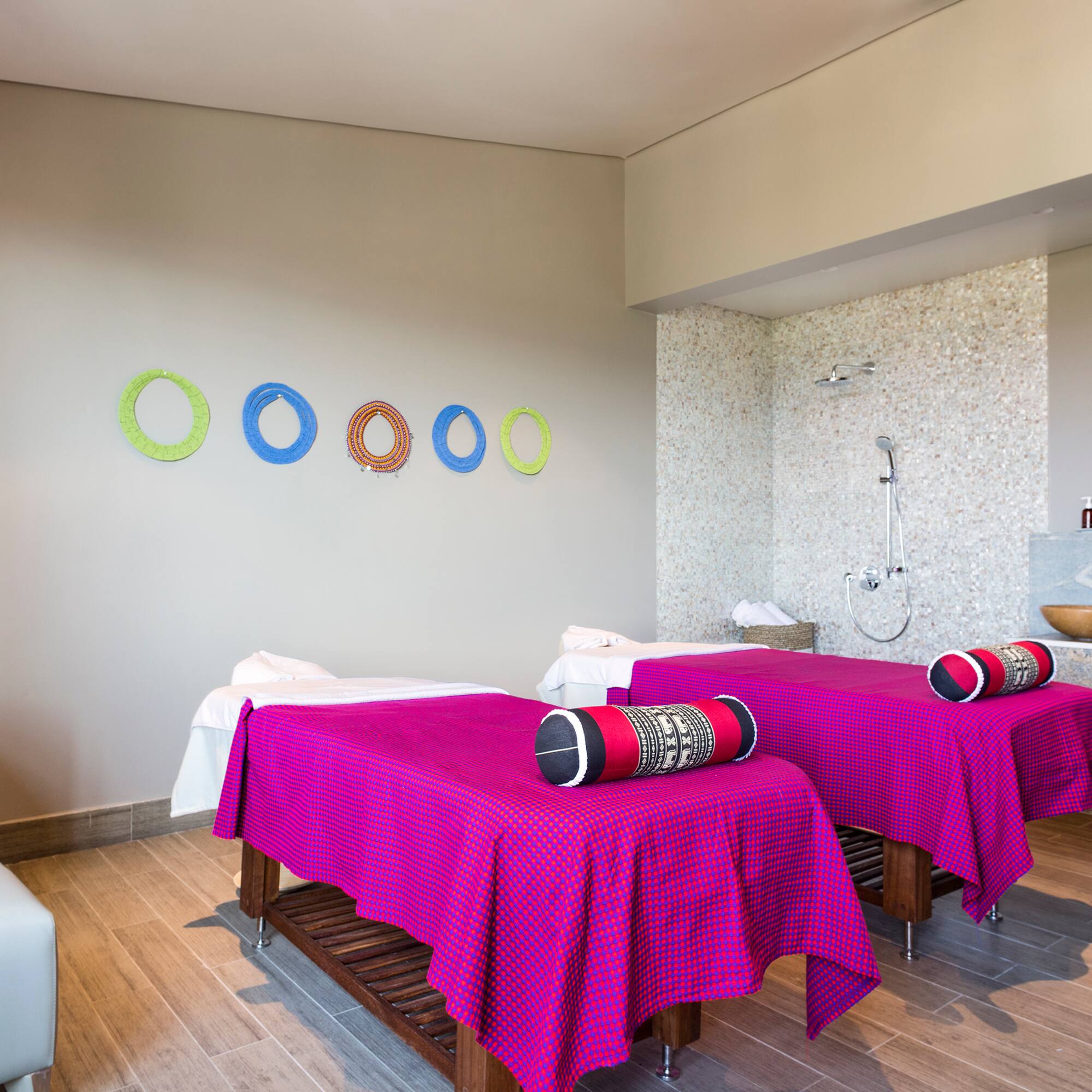 a room with beds and a shower