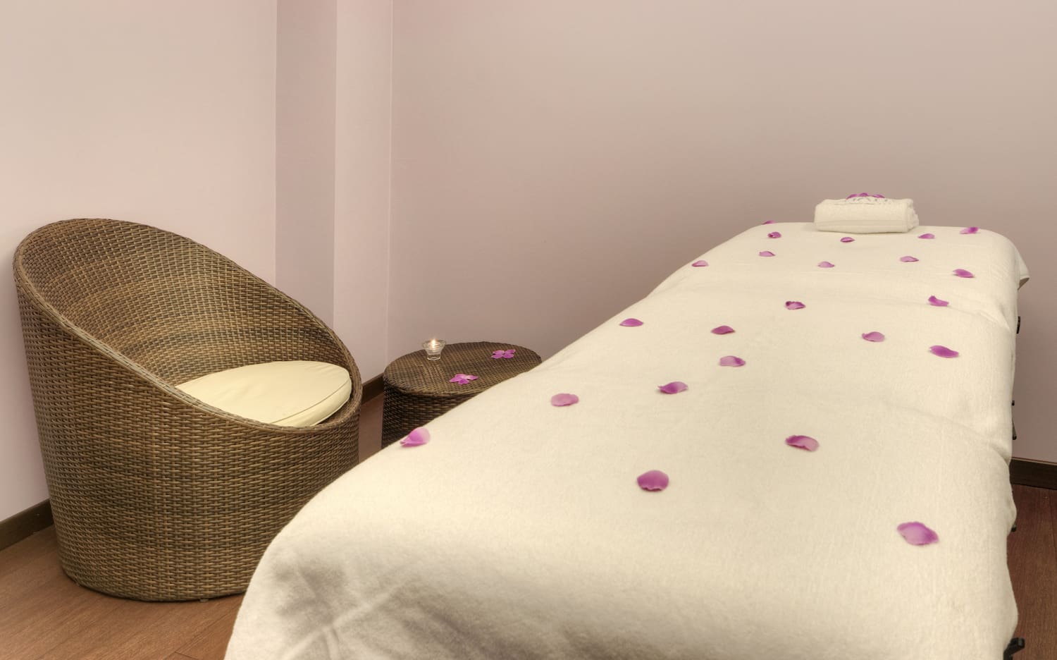 a bed with petals on it