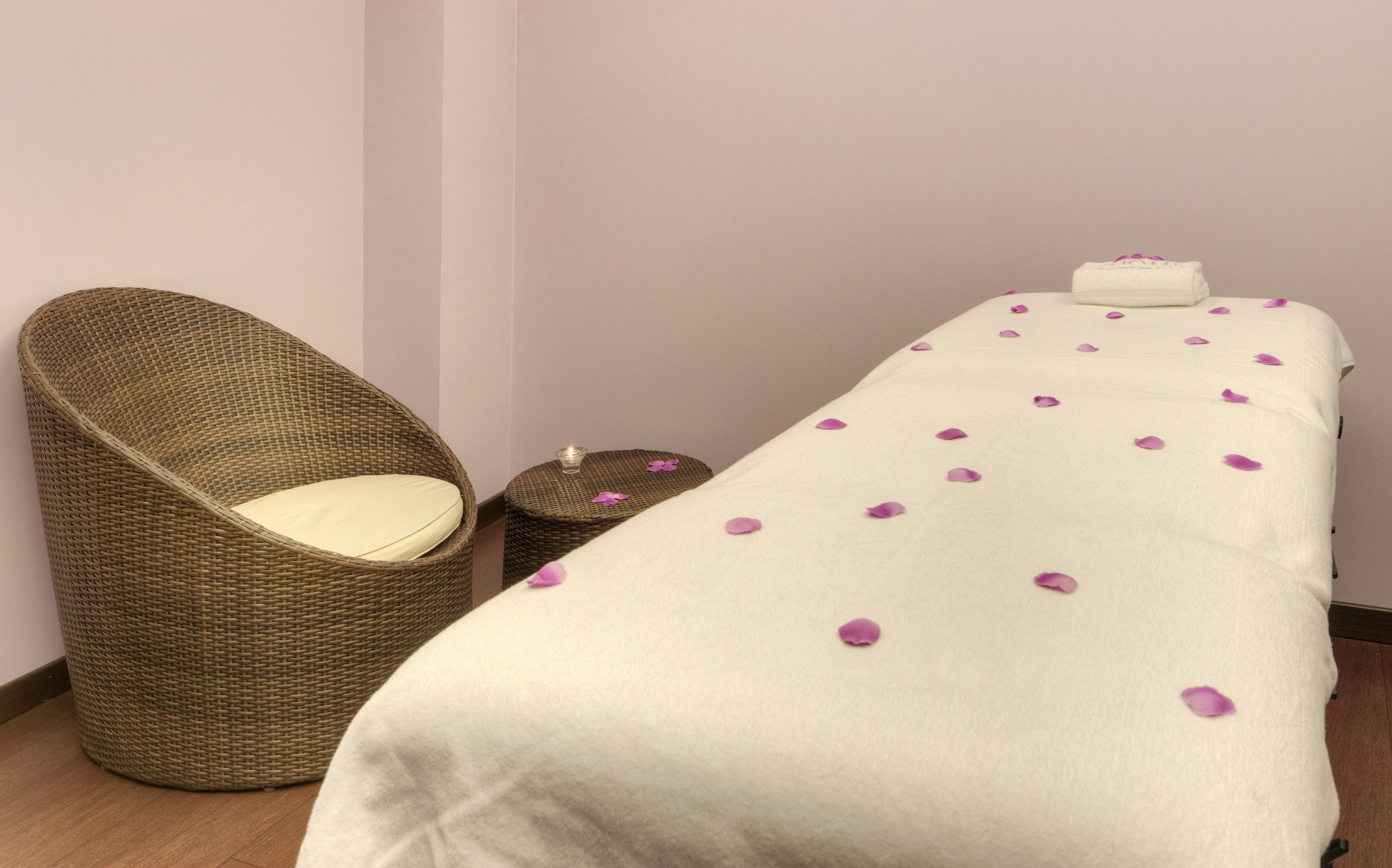 a bed with petals on it