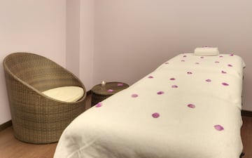 a bed with petals on it